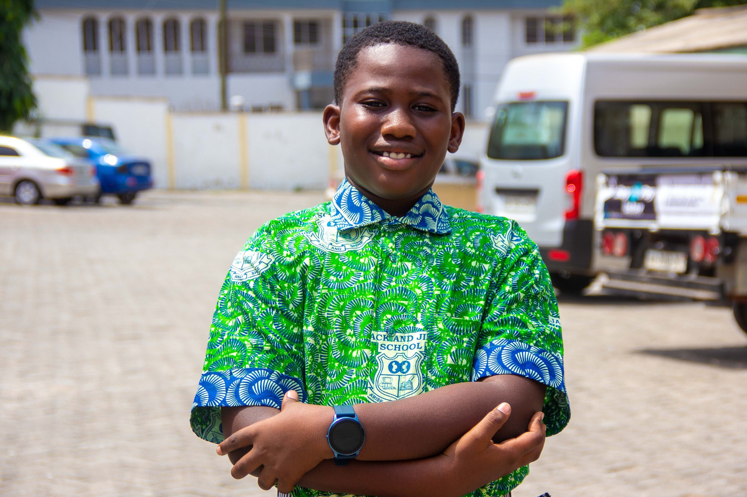 A pupil in Friday wear with the Arise and Shine crest