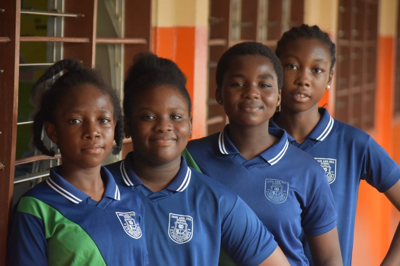Girls in royal blue club polo shirts