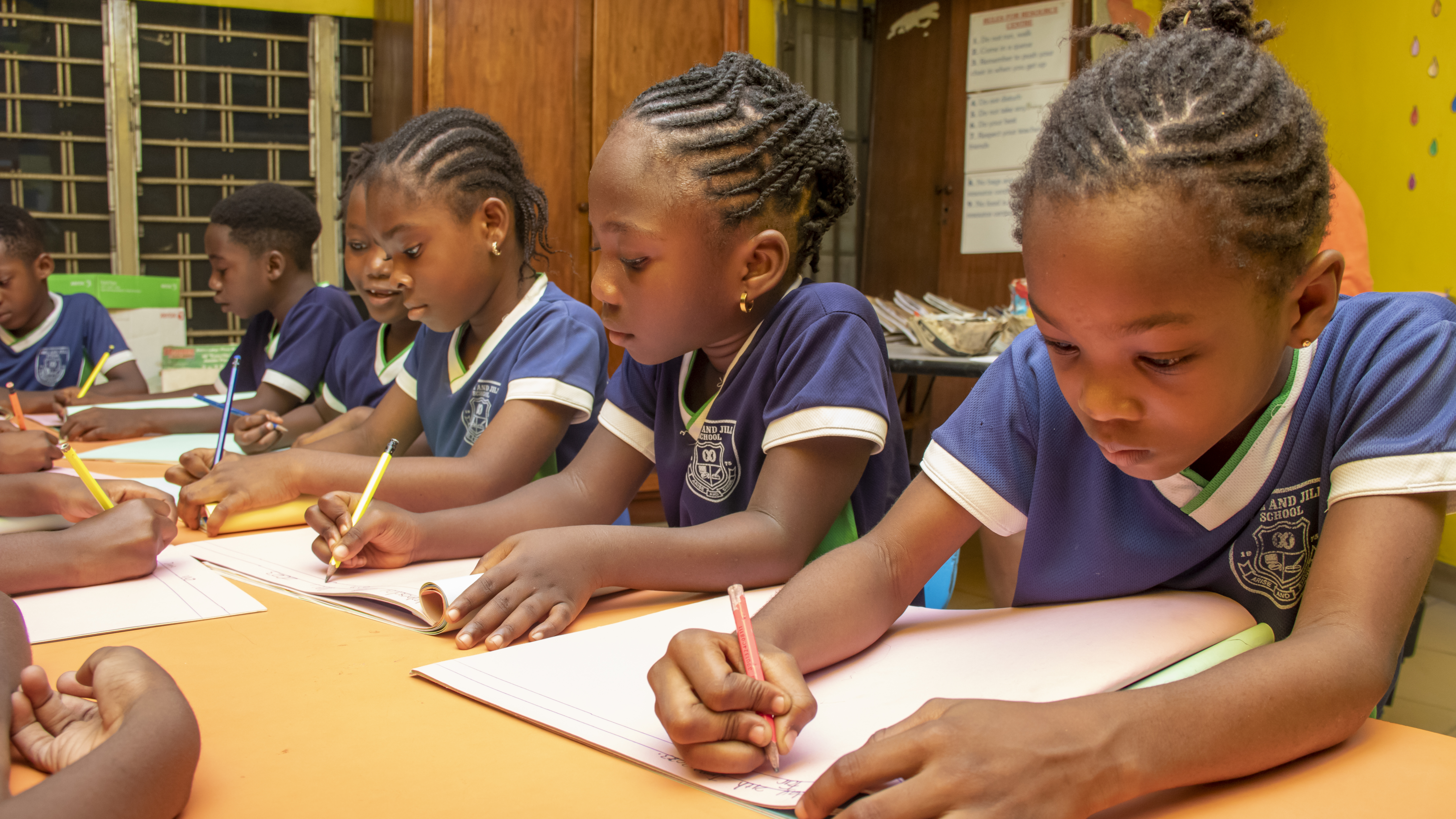 Jack and Jill School students focused on their writing in class